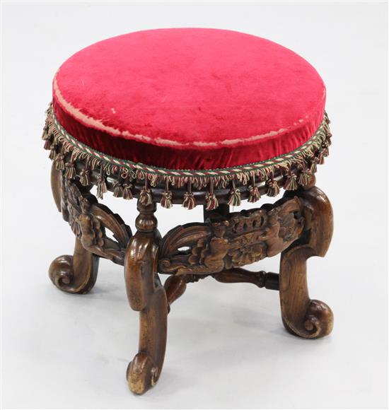 A Carolean style circular oak and fruitwood upholstered stool, W.1ft 4in.